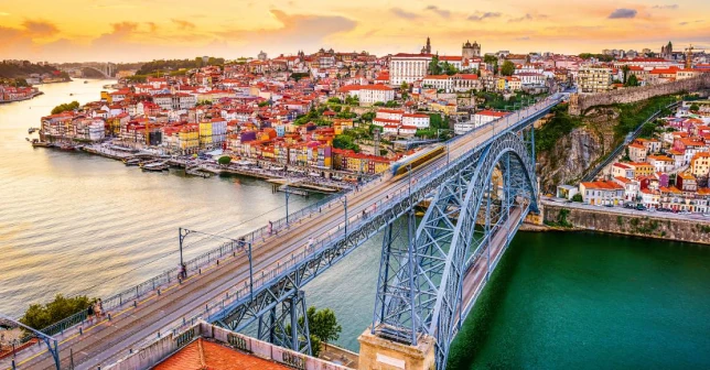 Porto bridge. Two destinations for golf holidays, Lisbon and Porto, regarded as some of the friendliest cities in Europe